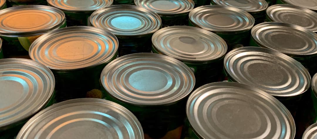 Worker at canned food production